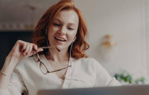woman concentrated on latptop and watches video