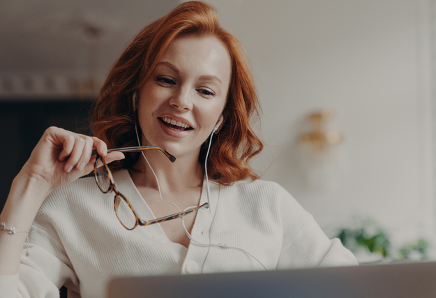 woman concentrated on latptop and watches video